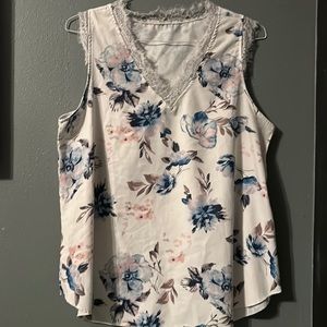 White blouse with blue pink and purple floral design and lace lining